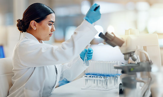 Lab worker performing tests.